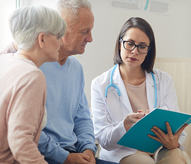 Senior couple talking to doctor